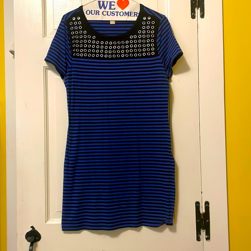 Adorable Michael Kors dress featuring silver grommet details at the neckline.